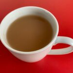 Chai latte on red table top