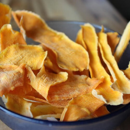 Image if a blue bowl filled with Sweet Potato Crisps prepared in the Microwave