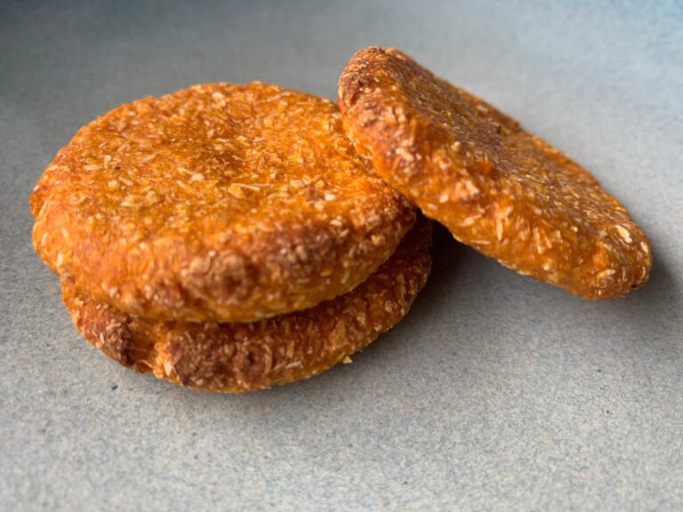 Close-up of sweet potato patties stacked on a plate