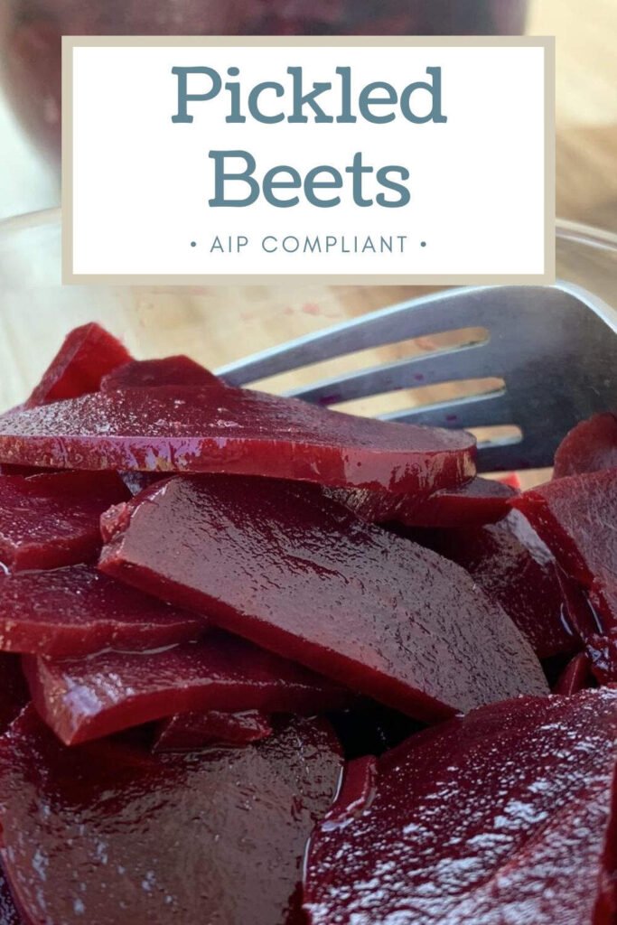 Glass bowl with sliced pickled beetrrot and text overlay that reads "pickled beets - AIP compliant"
