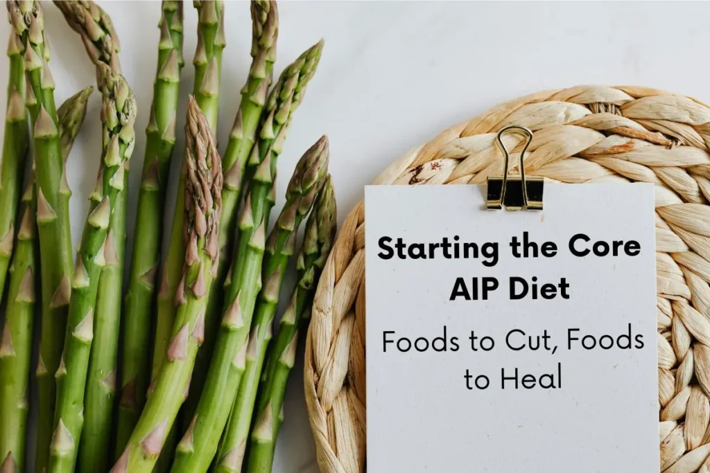 Clipboard lying next to some cut up garlic. Text on the clipboard reads: Starting the Core AIP Diet: Foods to cut, foods to heal