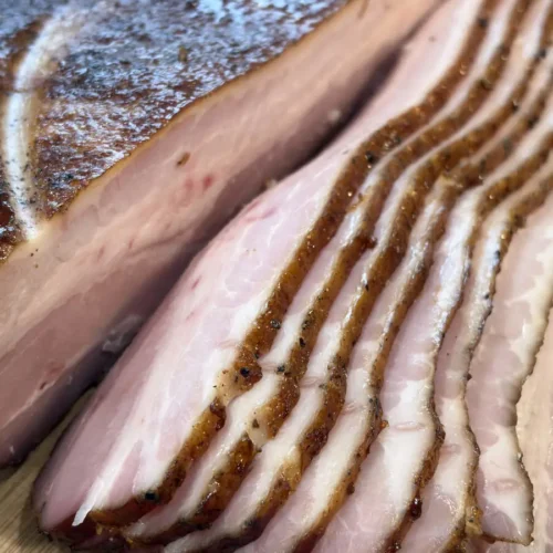 Thinly sliced homemade AIP bacon, cut into perfect pieces for breakfast or other recipes.