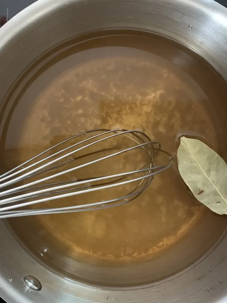 Pickling juice is warmed up to allow the honey to dissolve better.