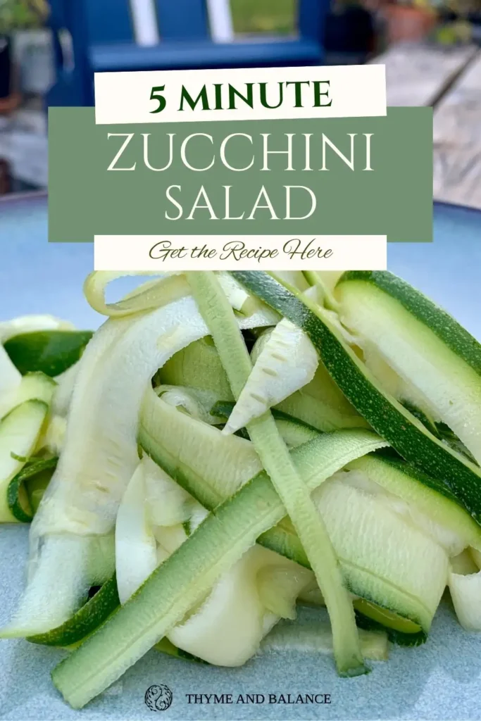 Close-up of zucchini ribbon salad on a blue plate with text overlay reading “5 Minute Zucchini Salad.”