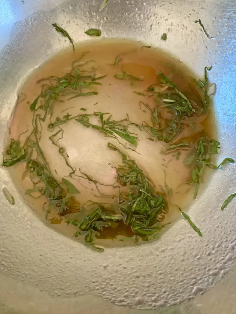 zucchini salad dressing with fresh basil leaves